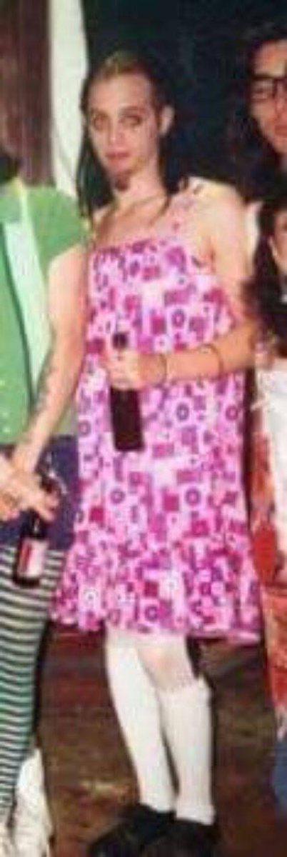 Earlier provenance photograph showing the same pink patterned dress being worn.