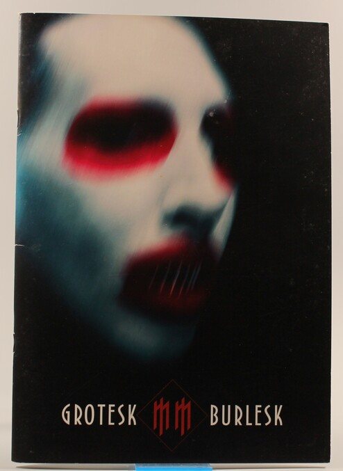 Front cover of the Grotesk Burlesk Tour programme, 2003.