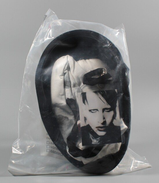 Reverse of the VIP merchandise package showing the printed evidence and chain-of-custody form.